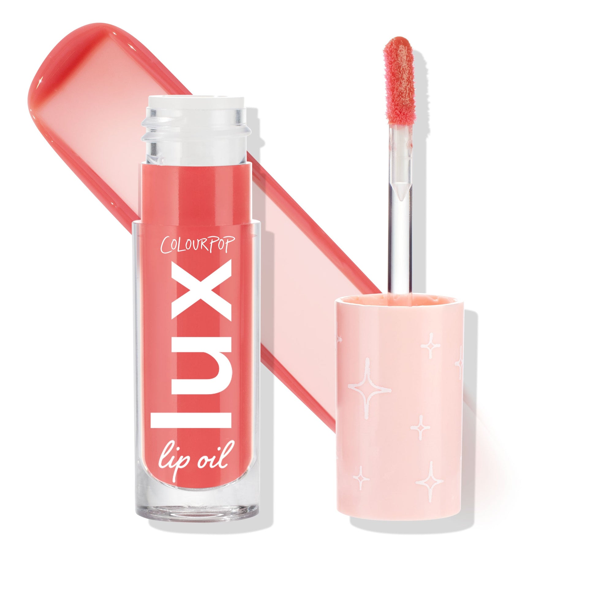 ColourPop Lux Lip Oil Bengal, cap off with doe-foot applicator coated in coral-pink oil, clear tube with white Lux logo and pale pink star-print cap, shown against a white background.