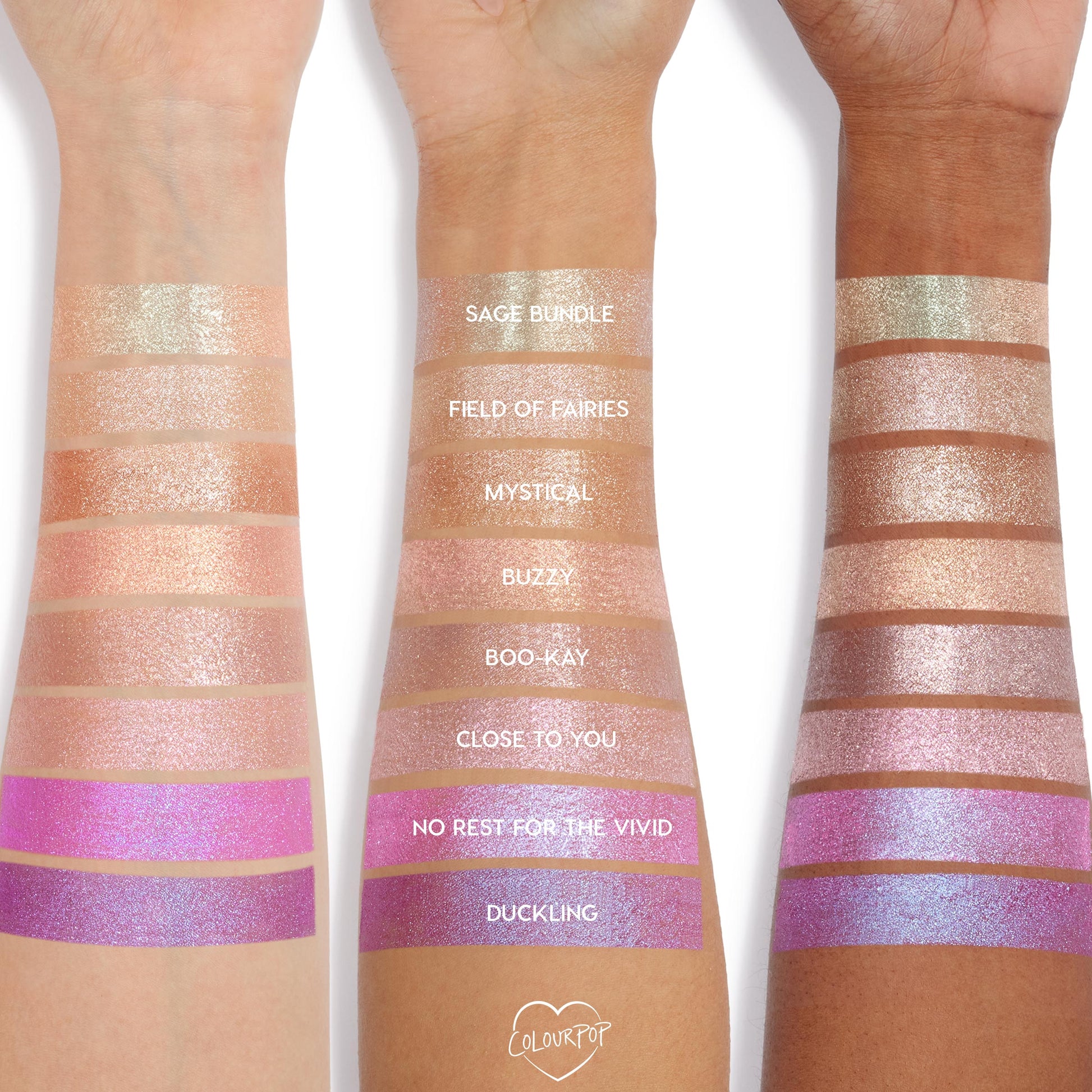 Colourpop Big Ego Jelly Much Shadow swatched on three arms, showing shimmering eyeshadow shades from soft champagne and peach to vivid pink and lavender, demonstrating pigment and finish across different skin tones.