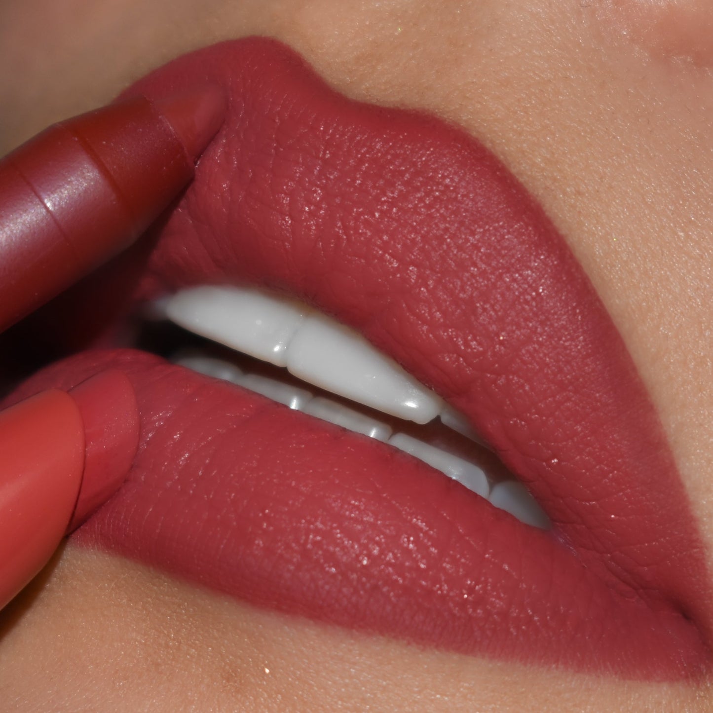 ColourPop Lippie Pencil in Bumble precisely lines full lips, the warm rose-mauve shade gliding along the cupid’s bow and lower lip for a smooth, matte finish in a close-up beauty shot.